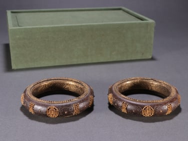A pair of Qing Dynasty agarwood bag golden longevity character bracelets