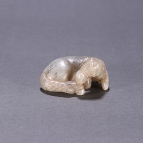 A piece of Hetian jade seed material lying horse