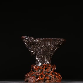 A Qing Dynasty small-leaved rosewood magnolia flower cup