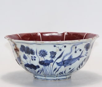 A ten-edged bowl with red glaze and outer blue fish and algae pattern in the Ming Xuande year