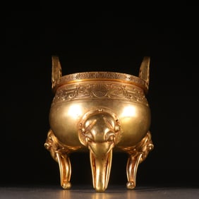 A Qing Dynasty copper gilt elephant trunk ear three-legged incense burner