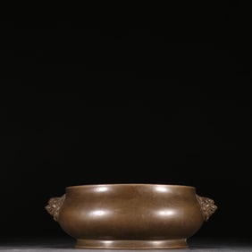 A Ming Dynasty copper lion's ear incense burner