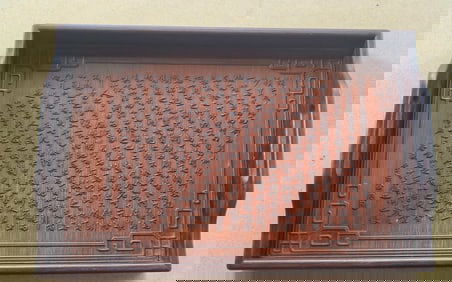 A carved pallet of mahogany inlaid bamboo from the Qing Dynasty