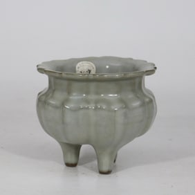 A Song official kiln celadon three-breasted foot incense burner