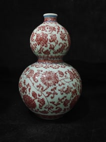 A glazed red entwined lotus gourd bottle