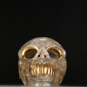 A crystal-clad gold-clad skull