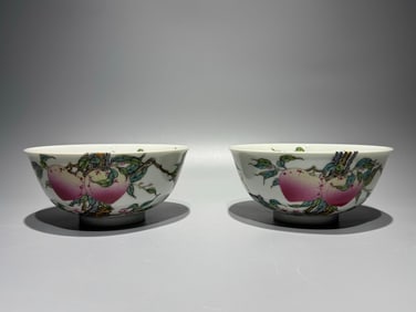 A pair of Qing Yongzheng pastel eight peaches and five bat bowls