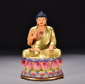 A Qing Qianlong enamel gilt Buddha statue of Shakyamuni Buddha