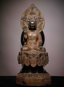 A Tang bluestone painted Buddha statue