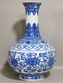 A Qing Qianlong blue and white entwined branch with an appreciation bottle