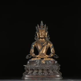 A Qing Dynasty copper-gilt longevity Buddha