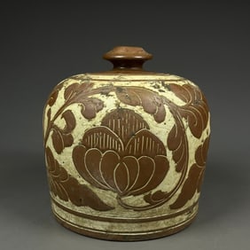 A Song Jiexiu kiln sauce glaze carved flower pattern bottle