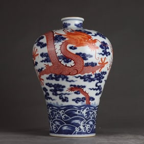 A Qing Qianlong blue and white alum red dragon pattern plum bottle