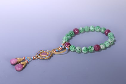 A piece of Qing court jade eighteen seeds held