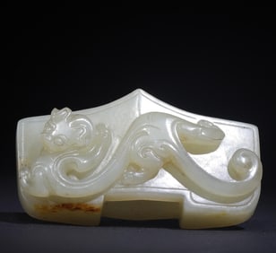 A Qing Dynasty jade carved dragon sword with a sword treasure