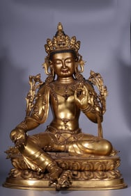 A Qing Dynasty bronze gilt free Guanyin seated statue
