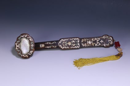 A Qing Dynasty small-leaved rosewood inlaid turquoise snail entwined floral pattern ruyi ornament