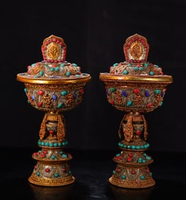 A pair  of Qing Dynasty Tibetan silver cloisonné gilt inlaid gemstone lampstands