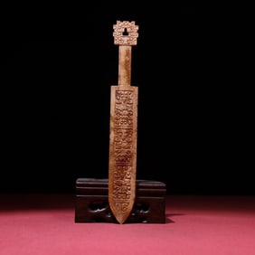 A white jade sword of the Warring States period full of gray skin and jade sword