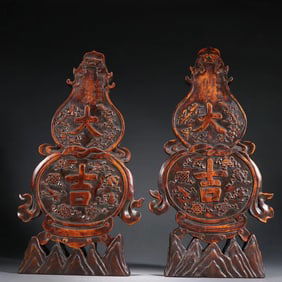 A pair  of sandalwood eight-treasure pattern ornaments