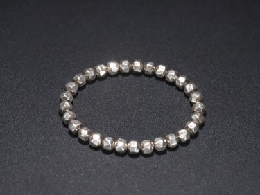 A silver prismatic bracelet