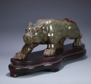 A large tiger ornament made of Xinjiang Hetian green jade seed material in the late Qing Dynasty