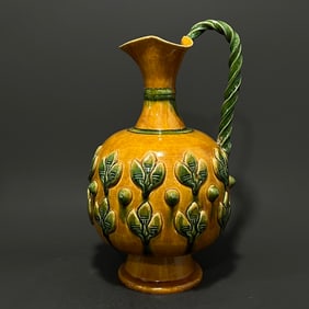 A Tanggong County kiln three-color carved flower pattern flower pouring pot