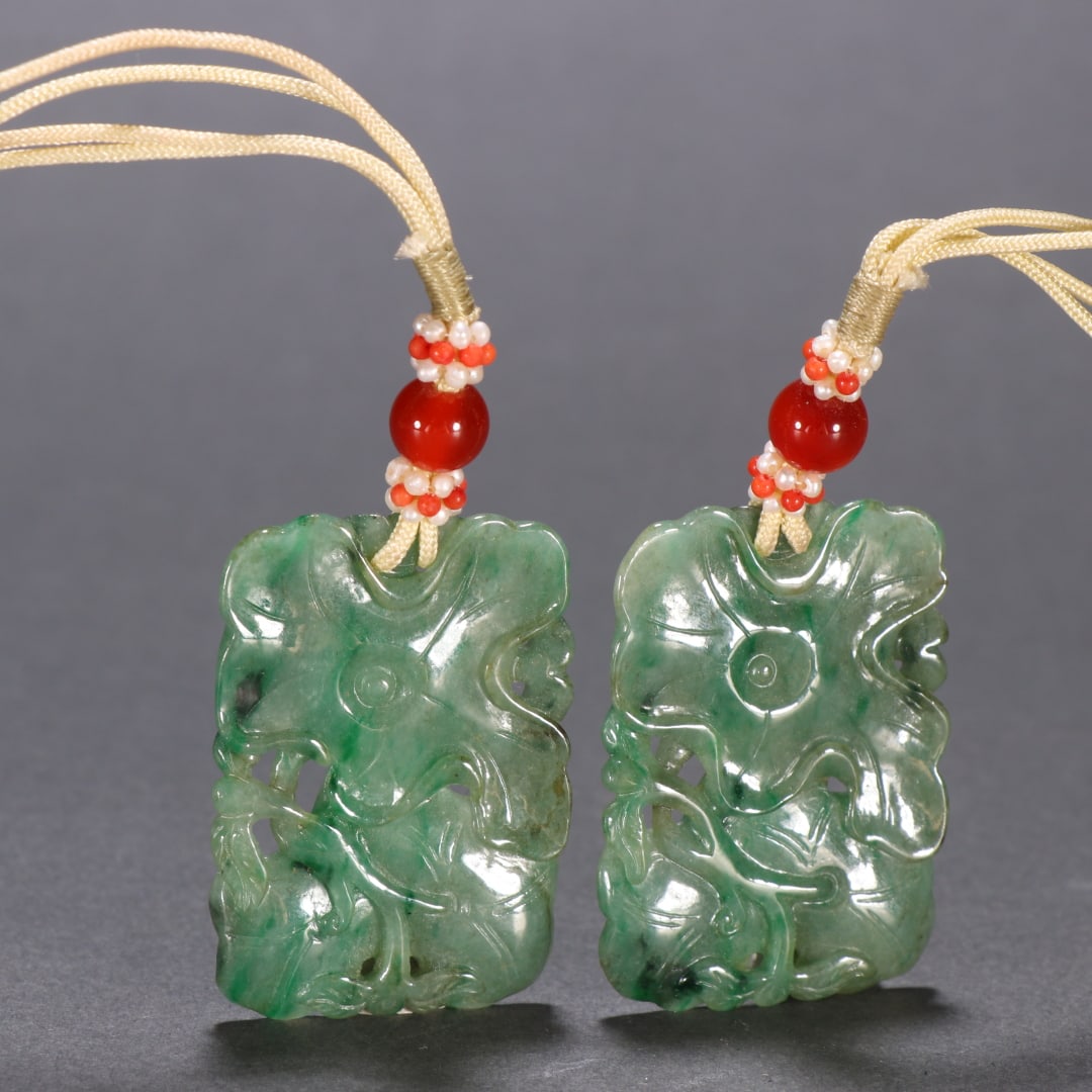 A pair of Qing Dynasty jade lotus leaf pattern pendants (1 of 9)
