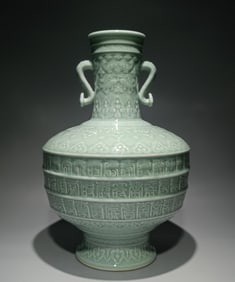 A piece of Qing Qianlong model bean celadon carving Fushou is more than ruyizun