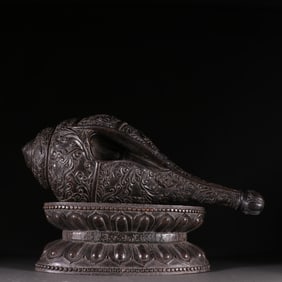 A Qing Dynasty agarwood inlaid turquoise snail ornament