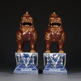 A pair  of blue and white eight treasure patterns rust red gilded auspicious beasts