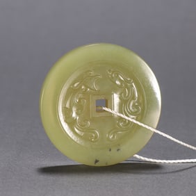 A Qing Dynasty Hetian topaz Taiping Tongbao pendant