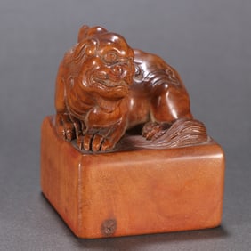 A Qing Dynasty sandalwood beast button seal