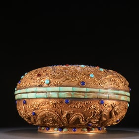 A Qing Dynasty copper gilt inlaid gemstone dragon pattern lid box