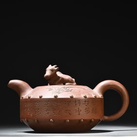 A purple sand carved orchid bamboo teapot made by Xishan Yu