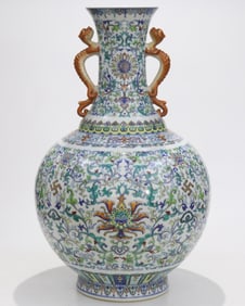 A Qing Qianlong year Doucai Wanfu Qingshou red dragon ear bottle