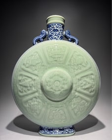 A Qing Qianlong model blue and white entwined lotus window bean blue glaze carved eight treasure