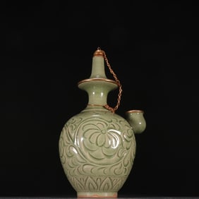 A Song Dynasty Yaozhou kiln carved flower clean bottle