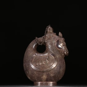 A sterling silver horsehead leather pot