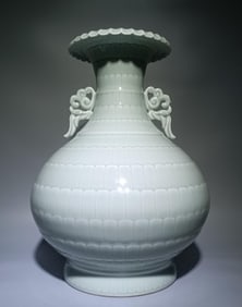A Qing Qianlong model bean blue glaze carved lotus petal pattern amphora appreciation bottle