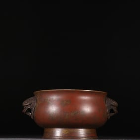 A Ming Dynasty Xuande lion's ear incense burner