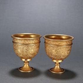 A pair  of Tang silver gilt hunting picture wine glasses