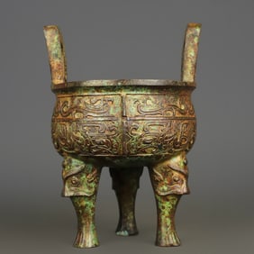 A bronze beast face pattern round tripod of the Western Zhou Dynasty