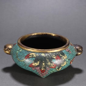 A Qing Dynasty copper-gilt cloisonné three-legged incense burner