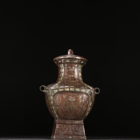 A copper wrong gold and silver square bottle