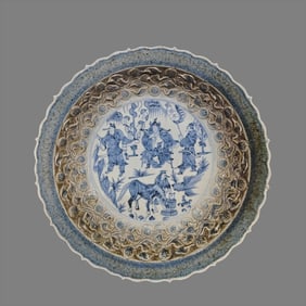 A Yuan Dynasty carved blue and white figure plate