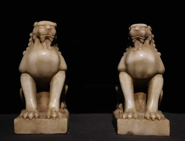 A pair  of Tang Dynasty white jade desk stone lions