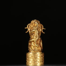 A Qing Dynasty copper gilt dragon button seal