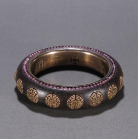 A Qing Dynasty agarwood inlaid silver gilt bracelet