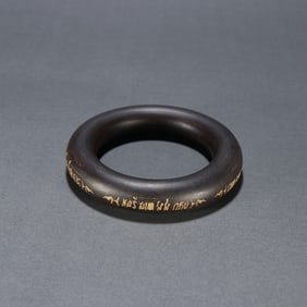 A Qing Dynasty agarwood gilded bracelet